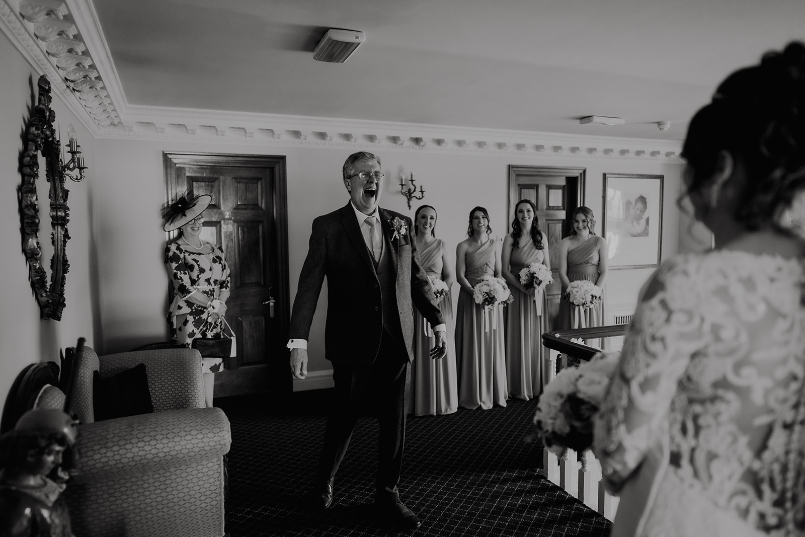 Unscripted moment as father sees his daughter on her wedding morning — genuine emotion captured through documentary photography by Lily & White