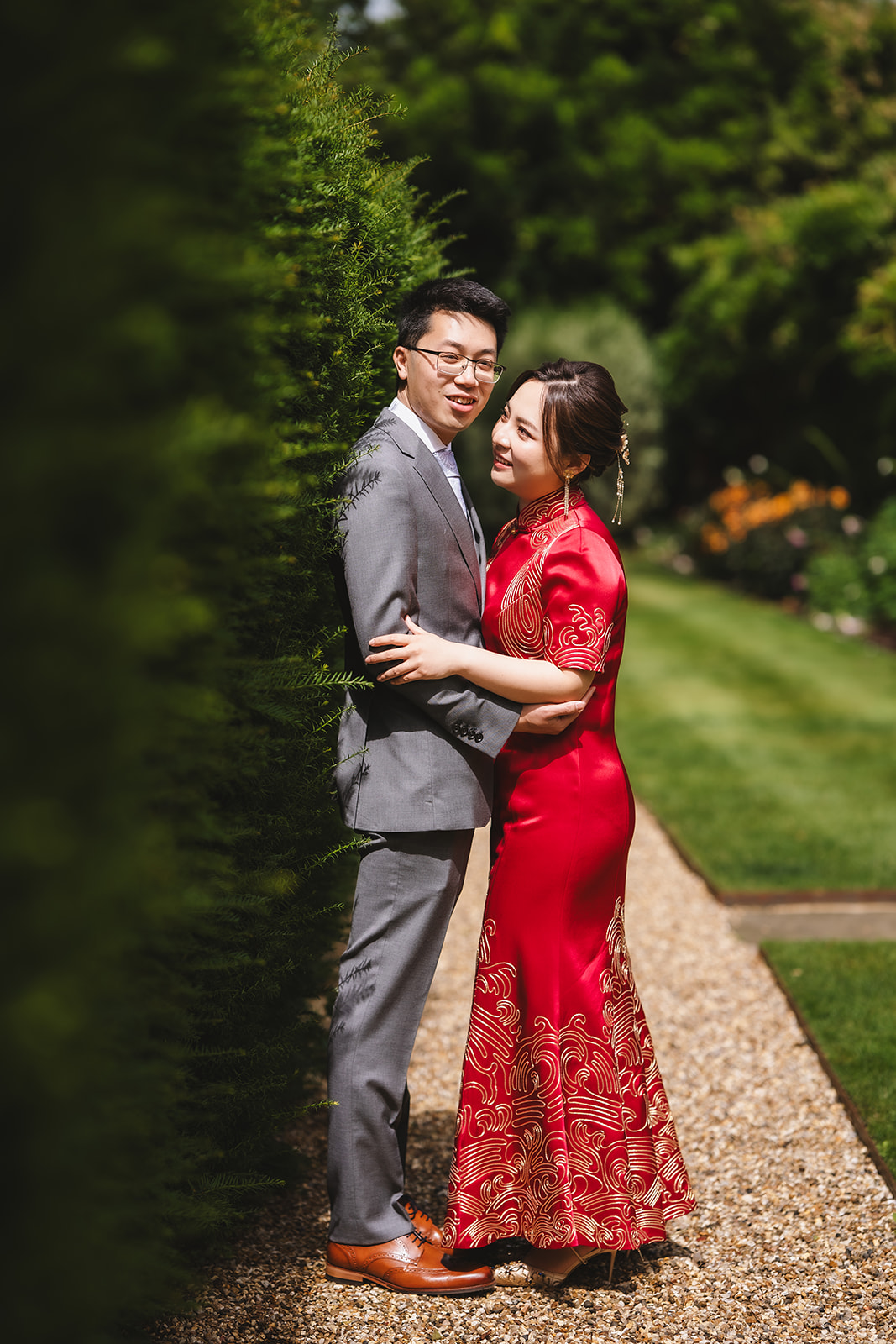Yiran and Jeffrey in the rose garden, Yiran in her red qipao – wedding photography by Tel, Lily & White