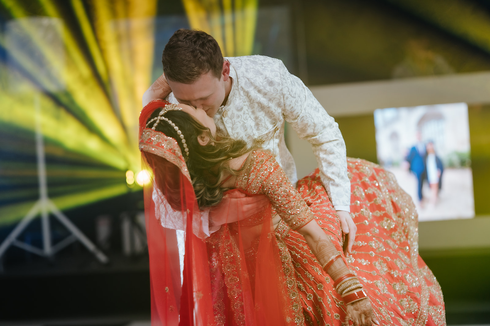 Honica and Ben first dance at Braxted Park - bride in lehenga and groom in sherwani during the Hindu fusion wedding evening reception Essex