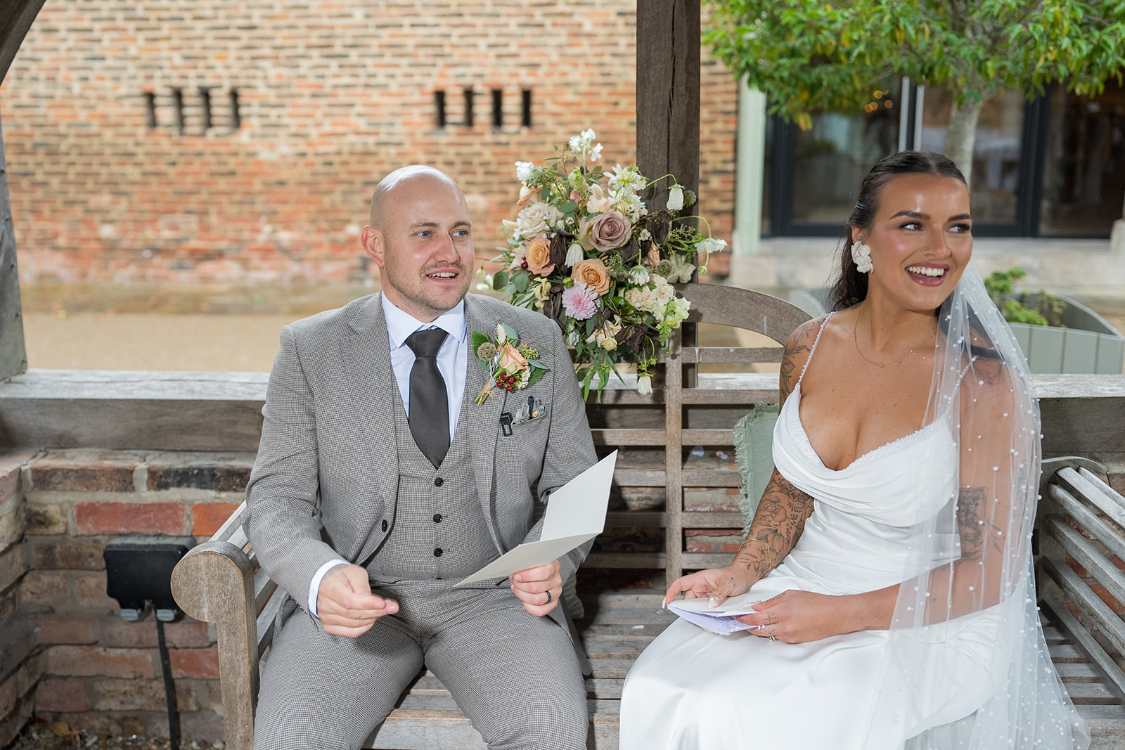 Sally and Callum laughing together during their Hornington Manor wedding portraits